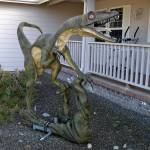 This model of a velociraptor stands on a weather vane that its owner, Tom Runyan, crafted for it to rotate on in front of their home in Dungeness Heights, north of Sequim. (Matthew Nash/Olympic Peninsula News Group)