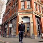 Bill Tennent, executive director of the Port Townsend Historical Society, stands before the N.D. Hill Building at 635 Water St. The building started life as a pharmaceutical warehouse but was best known as the site of the town tavern. It will be on Saturdays historical walking tour. (Jeannie McMacken/ Peninsula Daily News)