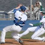 Port Angeles Gavin Guerrero, right, slides safely into home as Aberdeen pitcher Jaxson Larson waits for the ball after a wild pitch slipped past catcher Josh Germeaux in the second inning on Saturday at Port Angeles Civic Field.                                Keith Thorpe/Peninsula Daily News