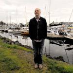 Northwest Maritime Center Executive Director Jake Beattie stands at the Point Hudson campus that his nonprofit wants to manage. A plan was submitted to the Port of Port Townsend in January that proposes a 50-year master lease, payments, investments and revenue sharing. (Jeannie McMacken/Peninsula Daily News)