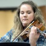 Lauren Waldron, a senior at Port Angeles High School, practices her viola during lunch Monday. She recently learned she had earned the National Federation of Music Clubs Wendell Irish Viola Award. (Jesse Major/Peninsula Daily News)