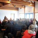 A crowd of concerned residents listen as Karen Goschen, Port of Port Angeles Executive Director, talks about a public process to consider a developers interest in purchasing the John Wayne Marina. Michael Dashiell/Olympic Penisula News Group