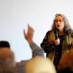 Karen Goschen, Port of Port Angeles Executive Director, talks about a public process to consider a developers interest in purchasing the John Wayne Marina at a meeting at the marina. Michael Dashiell/Olympic Penisula News Group