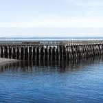 The Port of Port Townsend commissioners agreed to replace the Point Hudson south jetty breakwater, with work beginning this September. The new steel combination wall breakwater includes steel pipe, galvanized steel sheet pile, concrete cap and riprap slopes. Dredging, navigation aids and site restoration are also part of the project. (Jeannie McMacken/Peninsula Daily News)