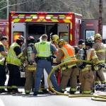 First responders help a victim following a collision on state Highway 19. (Patricia Willestoft/East Jefferson Fire Rescue)