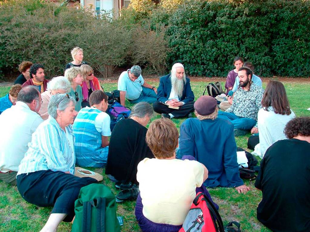 Sequim resident Joy Helmer, far back left, sits with a compassionate listening delegation as they listen to an Israeli settler in the West Bank/Palestine in the early 2000s.