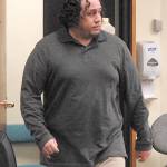Marshall Jay Lewis of Sedro-Woolley enters Clallam County Superior Court in Port Angeles on Wednesday during his trial on charges of felony first-degree arson and residential burglary, and gross misdemeanor telephone harassment, cyberstalking and disclosing intimate images. (Keith Thorpe/Peninsula Daily News)
