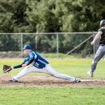 <strong>Steve Mullensky</strong>/for Peninsula Daily News                                Quilcenes Jake Oen is thrown out at first base in the first game of a Friday double-header against the Chimacum Cowboys in Quilcene. Making the stretch is the Cowboys Cody Clark.
