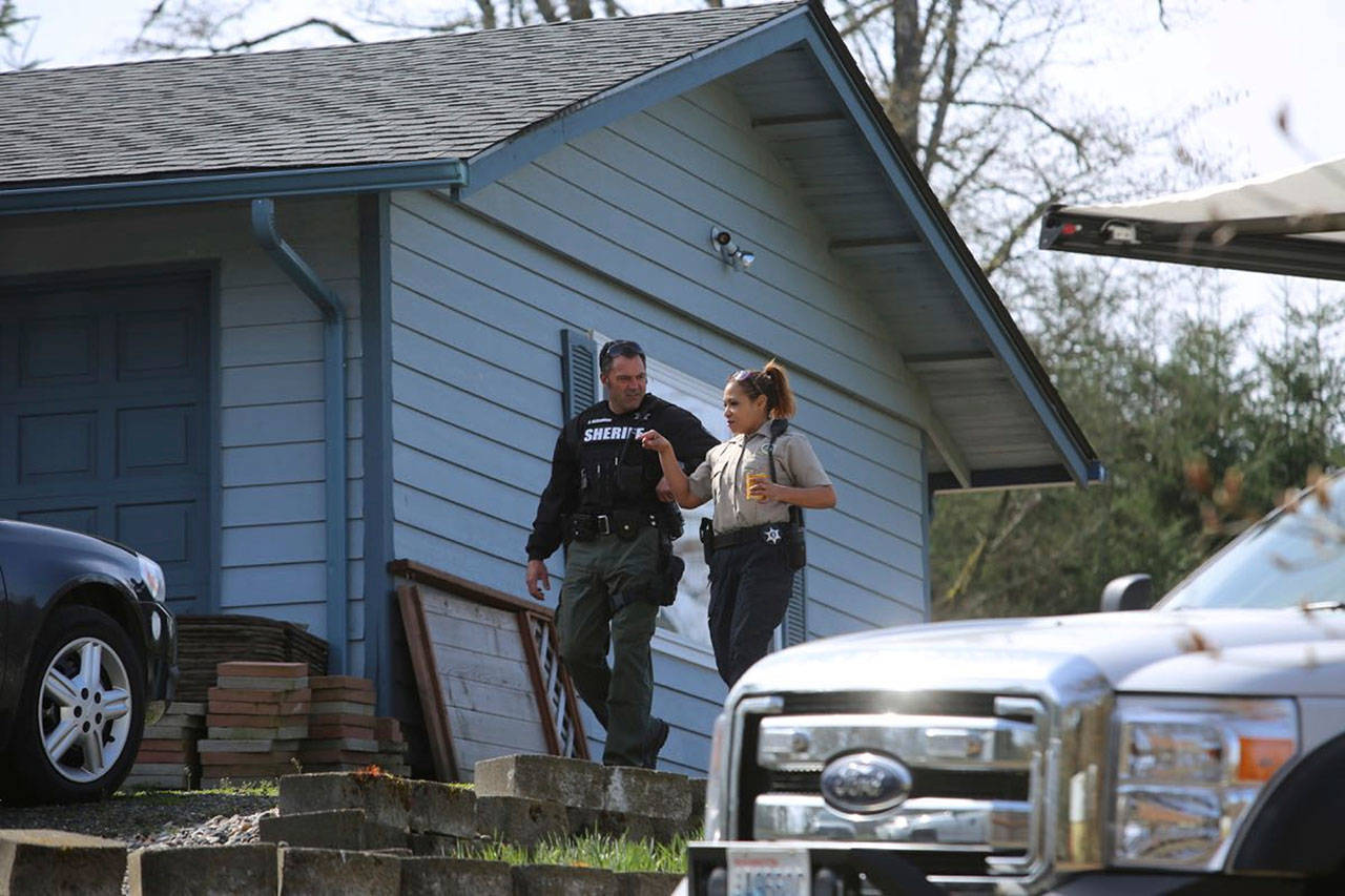 Authorities were investigating at the home of Jennifer Jean Hart, Sarah Margaret Hart and the six Hart children Thursday. (Jim Ryan, staff/The Oregonian via AP)