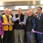 District 24 state Rep. Steve Tharinger, D-Sequim, cuts the ribbon on the Guy Cole Events Centers new kitchen last Wednesday. He and several other dignitaries attended, including city councilors, members of Guy Coles family, state Sen. Kevin Van De Wege and retired Sequim City Manager Steve Burkett. (Matthew Nash/Olympic Peninsula News Group)
