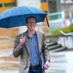 U.S. Rep. Derek Kilmer, D-Gig Harbor, walks across the Peninsula College campus to his town hall meeting Wednesday. (Jesse Major/Peninsula Daily News)