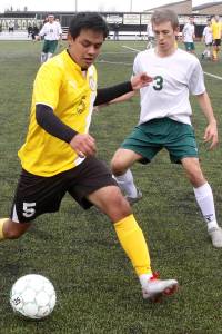 BOYS SOCCER: Roughriders, Wolves duel to a high-scoring draw