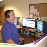 Kevin Watson, public safety dispatcher, takes calls at Olympic National Park on Tuesday. Thanks to a $1 million gift to Washingtons National Park Fund, Olympic National Park and Mount Rainier National Park are working together to implement a new computer aided dispatch system. (Penny Wagner/Olympic National Park)