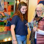 At the Port Townsend Film Festival office, Janette Force, right, discusses this weekends Women & Film program with granddaughter Molly Force. (Diane Urbani de la Paz/for Peninsula Daily News)