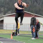 Forks Cole Baysinger competes in the long jump at the Forks Lions Club Invitational. Baysinger won the event with a leap of 19-10. (Lonnie Archibald/for Peninsula Daily News)