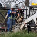 An employee rolls up his sleeves as work continues at Kinder Morgans facility in preparation for the expansion of the Trans Mountain Pipeline in Burnaby, B.C., on April 9. (Darryl Dyck/The Canadian Press via AP)