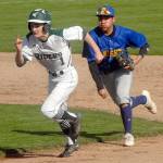 Port Angeles Daniel Basden tries to outrun Bremerton shortstop Hector Infante after being caught between bases during the first inning on Wednesday at Port Angeles Civic Field.                                Keith Thorpe/Peninsula Daily News