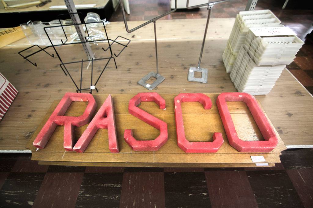 Among the items Bay Variety is selling is this Rasco sign, the stores former namesake. (Jesse Major/Peninsula Daily News)