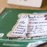 Customers have been writing down their memories of Bay Variety in this notebook at the front of the store. (Jesse Major/Peninsula Daily News)