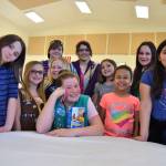Girl Scouts with Troop 45181 gather around Paige Krzyworz, 11, front center, to celebrate her accomplishment of selling the most boxes of Girl Scout cookies in Western Washington. (Matthew Nash/Olympic Peninsula News Group)