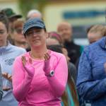 Women applaud as Carrie Sanford explains why she organized Sundays Run Without Fear. (Jesse Major/Peninsula Daily News)