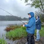Steve Mullensky/for Peninsula Daily News Brian and Karin Kirkwood, from Kingston, have Anderson Lake practically all to themselves on the opening of trout season on Saturday. The Kirkwoods have been coming to Anderson for 8 years because they catch and release and the fish are hooked on the lip and are easier to de-hook.