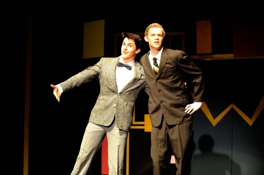 Thomas Hughes and Jonathan Heintz act out an animated scene from How to Succeed in Business Without Really Trying. (Erin Hawkins/Olympic Peninsula News Group)