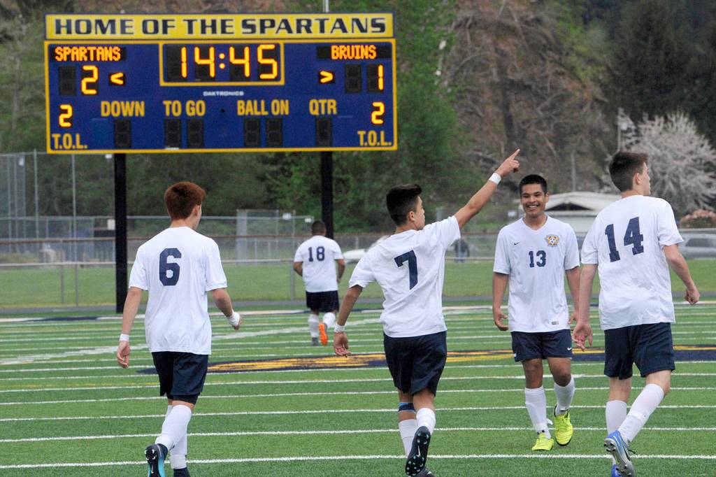 Lonnie Archibald/for Peninsula Daily News Forks Hugo Sandoval (7) celebrates after putting Forks ahead 2-1 with his second penalty kick late in the Spartans 3-2 overtime loss to Columbia (White Salmon).