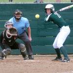 Keith Thorpe/Peninsula Daily News                                Port Angeles Erin Edwards watches the delivery to Kingston catcher Meghan Fenwick in the first inning on Wednesday at the Dry Creek athletic fields in Port Angeles. Edwards hit a three-run home run in her at-bat.