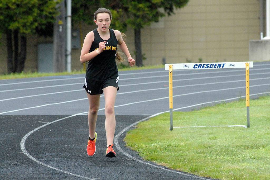 Miranda Tyree of Clallam Bay makes the final turn in the girls 1600 meter run at Crescent High School. (Keith Thorpe/Peninsula Daily News)