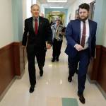 Gov. Jay Inslee, left, walks through a hallway inside Western State Hospital with Cheryl Strange, center, CEO of Western State Hospital, and David Westbrook, right, the Governors Director of Outreach, on Friday following a meeting with the hospitals executive team in Lakewood. (Ted S. Warren/The Associated Press)