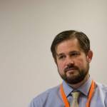 Port Angeles Community and Economic Development Director Nathan West tells state leaders and officials that ever-increasing regulations are a challenge for Port Angeles. (Jesse Major/Peninsula Daily News)