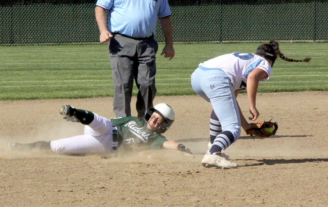 Port Angeles Sierra Robinson slides safely into second base ahead of the tag by Gig Harbors Lauren Forseth. Gig Harbor won the game 6-4 in the Roughriders final regular-season game of the year. (Dave Logan/for Peninsula Daily News)