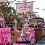 The 2018 Rhody queen, Ashley Rosser, rear, and Princesses Skyana Iardella and Lacey Bishop, wave to the crowd during the 2018 Rhody Parade tin Port Townsend on Saturday. (Steve Mullensky/for Peninsula Daily News)