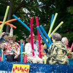 Senior participants in the 2018 Rhody Parade wave spaghetti floats along Monroe Street in Port Townsend on Saturday. (Steve Mullensky/for Peninsula Daily News)