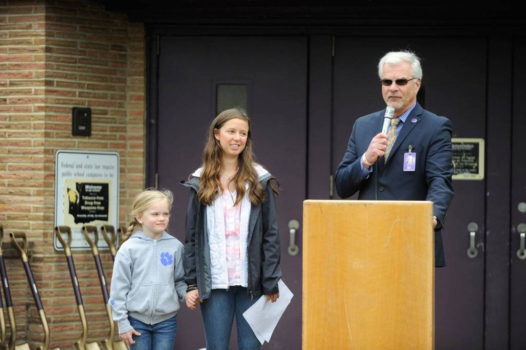 Sequim Schools Superintendent Gary Neal, right, with student board representative Tea Gauthun and Helen Haller kindergartner Emma Bixby, left, commemorate a historic moment for the district as it celebrates a new central kitchen that will be installed in the northwest corner of the Community School tentatively by the start of the next school year. (Erin Hawkins/Olympic Peninsula News Group)