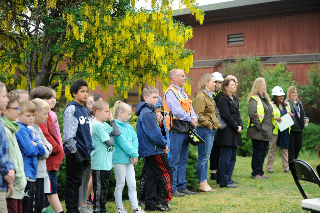 Students, faculty and Vanir Construction Management Inc. representatives listen as Sequim School District officials talk about moving forward with capital project goals at the groundbreaking ceremony last Friday. (Erin Hawkins/Olympic Peninsula News Group)