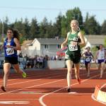 Port Angeles Gracie Long, right, reacts after winning the 1,600 meters at the state 2A Track and Field Championships at Mount Tahoma High School in Tacoma. At left is second place finisher Kristen Garcia of Sedro-Woolley. Long won with a personal-best time of 4:58.72. (Michael Dashiell/Olympic Peninsula News Group)
