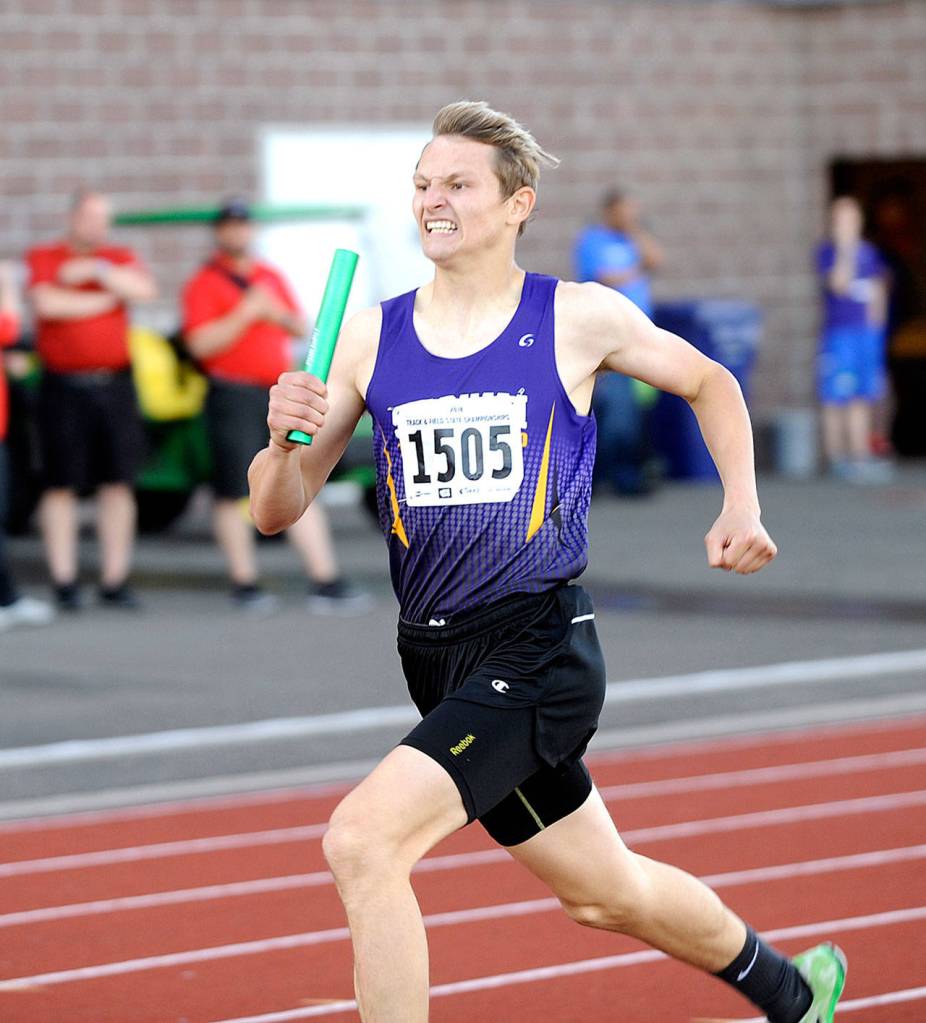 Sequims Murray Bingham carries the baton during the preliminaries of the 4x400 relay at the 2A state Track and Field Championships at Mount Tahoma High School. Sequim came in third in its heat and moved on to the finals late Saturday afternoon, seeded fifth. Other 4x400 members are Logan Laxson, Darren Salazar and Alec Shingleton. (Michael Dashiell/Olympic Peninsula News Group).