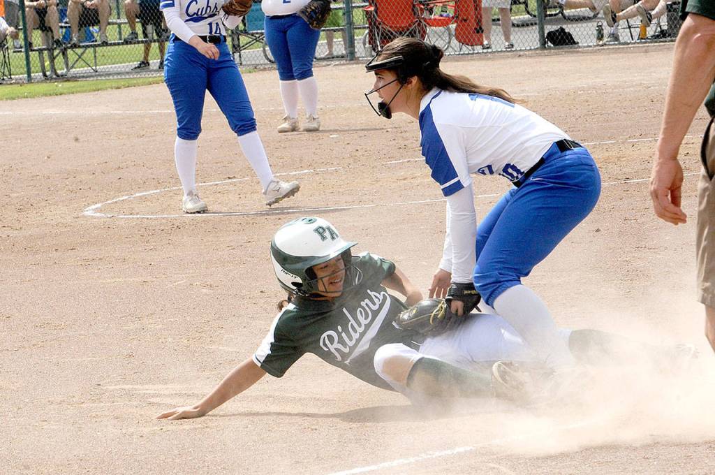 Port Angeles Camille Stensgard steals third against Sedro-Woolley Friday. Sedro Woolleys Madelyn Requa makes the tag. (Lonnie Archibald/for Peninsula Daily News)