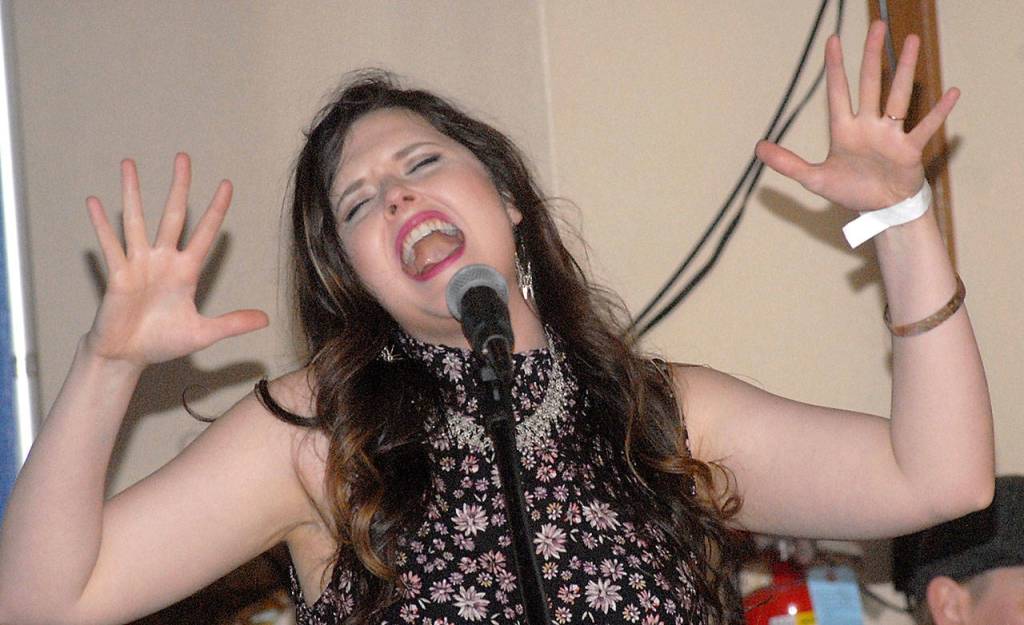 Halie Loren of Eugene, Ore., belts out a standard with her band on Saturday at the Naval Elks Club Lodge, one of four stages for the Juan de Fuca Festival. (Keith Thorpe/Peninsula Daily News)