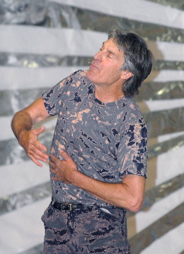 Dance, mime and voice actor Christian Swenson of Seattle practices what he calls human jazz on Saturday on the Main Stage in Vern Burton Community Center. (Keith Thorpe/Peninsula Daily News)