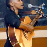 Afro-folk singer Naomi Wachira, who was born in Kenya and now lives in Seattle, shares her songs from the second stage at the Naval Elks Lodge on Saturday. (Keith Thorpe/Peninsula Daily News)
