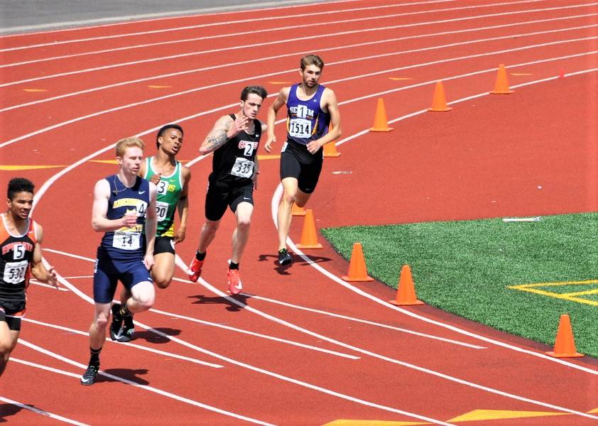 Sequims Alec Shingleton, far right, finishes sixth in the state in the 400-meter run.