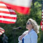 Amanda Bacon sings The Star-Spangled Banner during the Memorial Day ceremony at Mount Angeles Memorial Park on Monday. (Jesse Major/Peninsula Daily News)