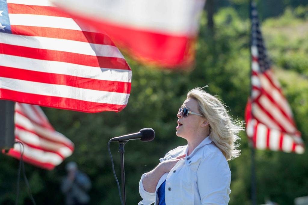 Amanda Bacon sings The Star-Spangled Banner during the Memorial Day ceremony at Mount Angeles Memorial Park on Monday. (Jesse Major/Peninsula Daily News)