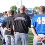 Don Descoteau/Black Press Port Angeles Lefties players and coaches line up during the national anthem before an exhibition road game against the Victoria HarbourCats at Royal Athletic Park on Wednesday.