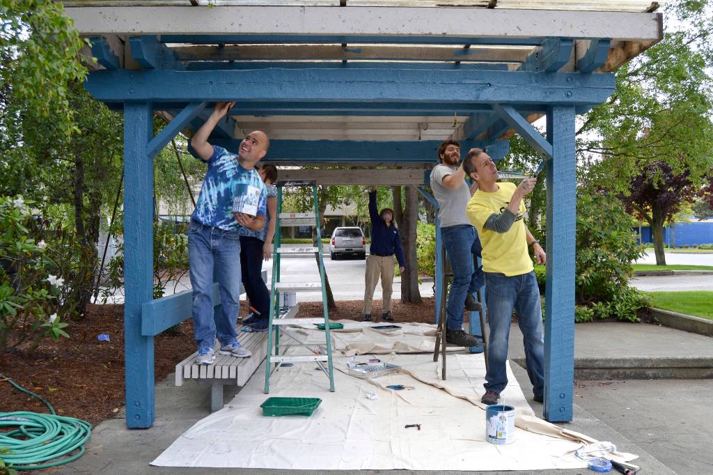 <strong>Matt Nash</strong>/Olympic Peninsula News Group                                From left, Sequim Assistant City Manager Joe Irvin, city intern Cassandra Bailey, volunteer Mike Vollenweider, city intern Guy Knapp and author Peter Kageyama paint the gazebo in 1st Security Bank Park on Tuesday for the first full day of Sequim Service Fest, which runs through June 15. For the full story, see <strong>Page A5</strong>.