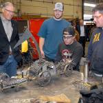 Keith Thorpe/Peninsula Daily News Washington Gov. Jay Inslee, left, examines a steampunk-themed metal artwork created by Peninsula College welding students, from left, Ellis Henderson of Port Townsend, and Nathan Hofer and Matthew Weaver of Port Angeles during the governors tour of the colleges welding class on the Port Angeles campus on Thursday. The shop tour was part of a presentation on economic opportunities and partnerships in the maritime industries on the North Olympic Peninsula.
