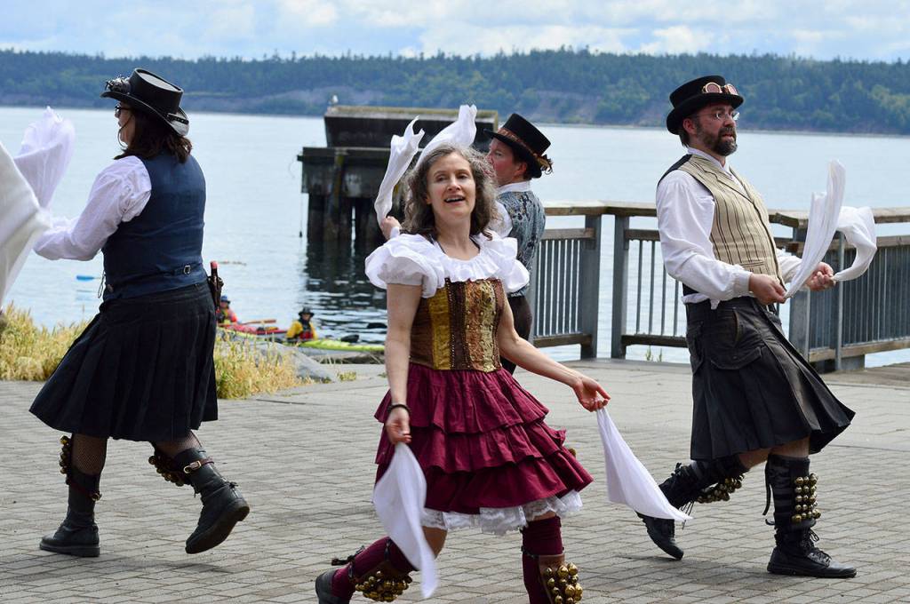The Sound and Fury Morris Dancers from Seattle brought out the sunshine Saturday afternoon at the Steampunk Festival in Port Townsend. (Diane Urbani de la Paz/Peninsula Daily News)